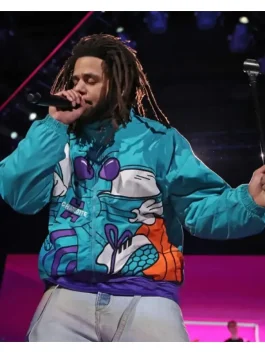 Rapper J. Cole wearing the NBA All Star Game Vintage 90’s Charlotte Hornets Jacket on stage, iconic Charlotte Hornets Jacket combining music and NBA fashion culture.