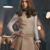 Amie Donald wearing M3GAN 2.0 costume in the 2025 movie, styled with vintage Peter Pan collar and pleated skirt, perfect M3GAN Halloween costume look.