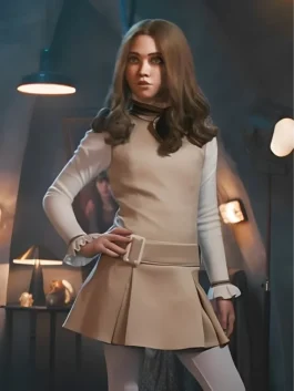 Amie Donald wearing M3GAN 2.0 costume in the 2025 movie, styled with vintage Peter Pan collar and pleated skirt, perfect M3GAN Halloween costume look.