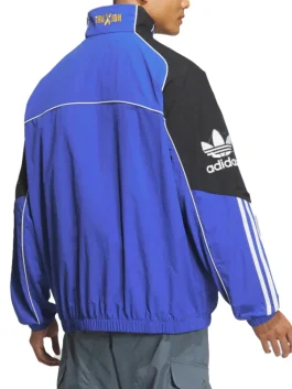 Back view of Adidas Adicolor Motorcore Woven Jacket in blue and black with bold white piping and Traxion branding on collar