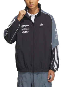Front view of black and gray Adidas Adicolor Motorcore Woven Jacket worn by male model