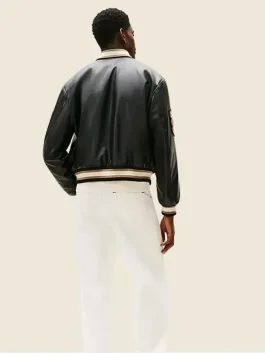 Back-Side-Of-The-APXGP-Damson-Idris-Black-Leather-Varsity-Jacket-on-a-Male-Model