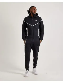 Front view of black Nike Tech reflective fleece tracksuit with white detailing and zip-up hoodie for men.