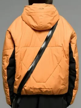 Back view of Death Stranding 2 jacket in orange with distinct zip details.