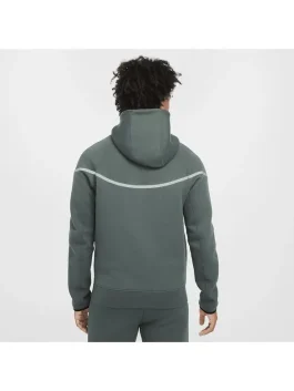 Back of green Nike Tech reflective fleece suit with reflective strip across shoulders.