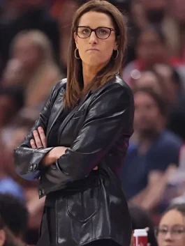 Stephanie White watching game with arms crossed.