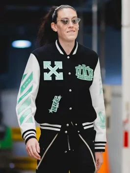 WNBA Off-White x New York Liberty Varsity Jacket featuring black and white design, worn by a fan showcasing Liberty basketball pride and WNBA streetwear jacket style.