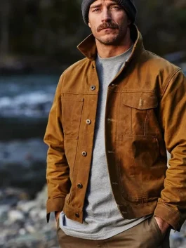 Man wearing Filson Tin Cloth Short Lined Cruiser Jacket in dark tan, durable waxed canvas workwear from America Jackets.