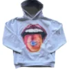 A grey home sick hoodie featuring a large graphic of a mouth and tongue. This homesick brand apparel is perfect for a trendy streetwear look.