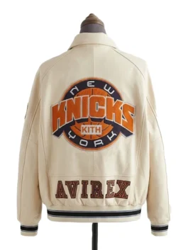 Full rear view of the cream Kith & Avirex leather jacket, showcasing a massive chenille New York Knicks Kith basketball patch and embroidered Avirex branding.