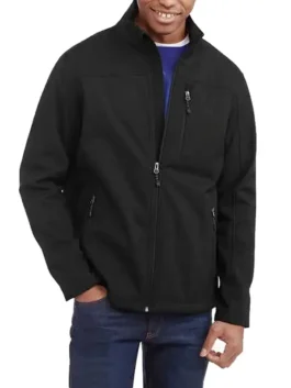 Model wearing a black Swiss Tech jacket for men. This swiss tech coat is a versatile men's softshell jacket and swiss tech apparel.
