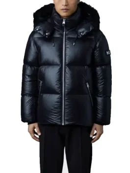 Model wearing black Mackage Kent Down Puffer Jacket showcasing modern fit, shiny exterior, and high-neck zip style.