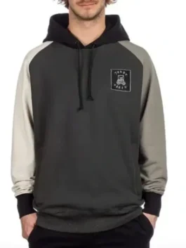 Male model wearing a black teddy fresh color block hoodie in gray, black, and light gray, a teddy fresh unisex hoodie.