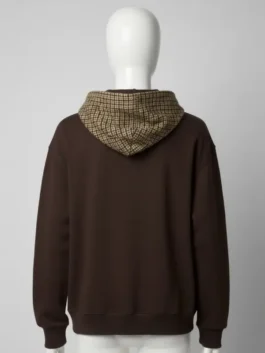 Back view of a relaxed fit brown houndstooth Gap pullover hoodie on a mannequin with check hood detail.