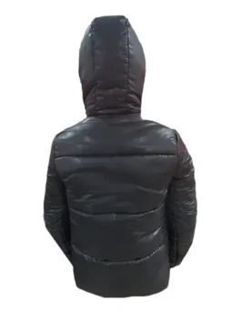 Back view of a sleek black Mackage Kent down puffer jacket with a hood. This men's Mackage puffer jacket is one of the essential Mackage coats men offering warmth and style. An example of a classic mackage jacket black.