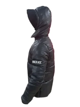 Side view of a black Mackage Kent-Z down puffer jacket for men, featuring the prominent white Mackage logo patch on the sleeve and a fixed hood. This Mackage jacket for men is a warm, fashionable mackage coat puffer option, suitable as a mackage mens winter coat.