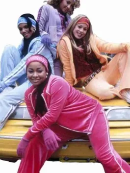 The Cheetah Girls cast posing in vibrant fleece cheetah girls track suit outfits, featuring pink, blue, orange, and lavender colors.