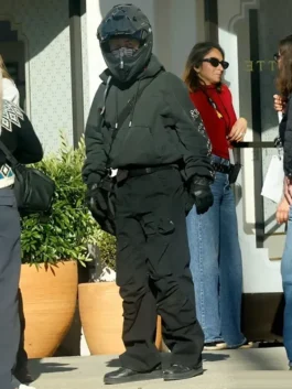 Crime 101 Barry Keoghan black pullover hoodie paired with tactical black pants and biker gloves on set.