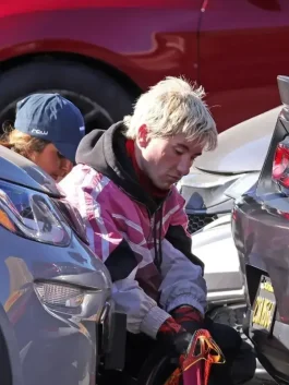 Barry Keoghan pink hybrid jacket from Crime 101 with biker track details and casual streetwear appeal.