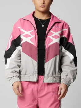 Crime 101 Barry Keoghan pink biker hybrid track jacket front view showcasing sporty design and vibrant pink pattern.