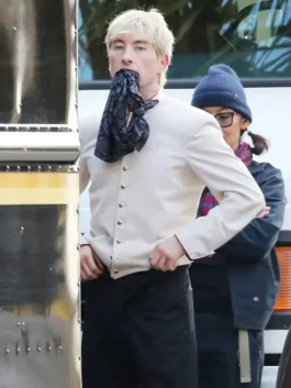 Barry Keoghan spotted in Crime 101 bellhop jacket styled with a black cap and movie-inspired attire.