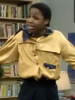 Theo Huxtable wearing the iconic yellow Gordon Gartrelle Shirt, a classic look that inspired the men's Gordon Gartrell shirt and the Anthony Mackie Gordon Gartrell Shirt collection.