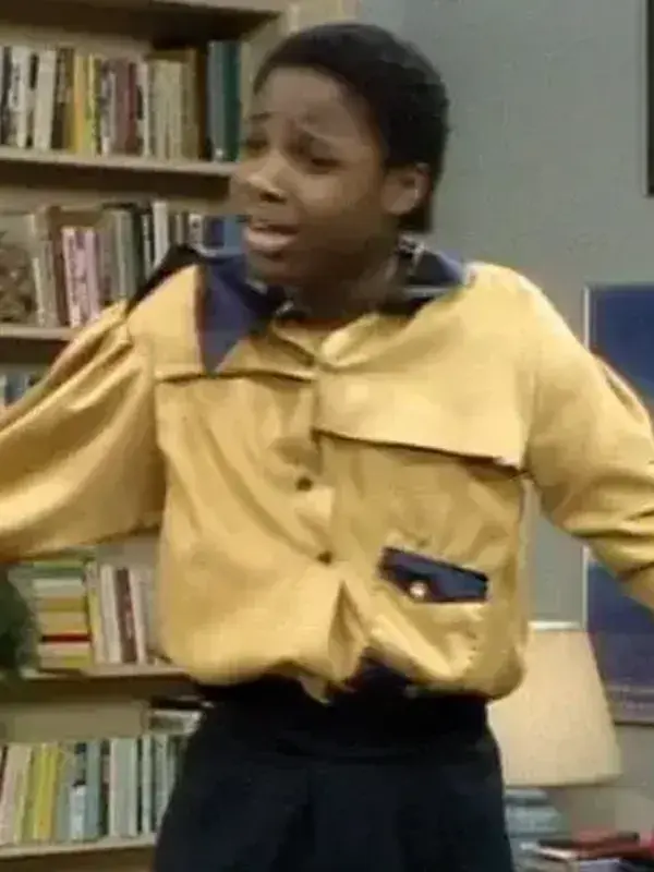 Theo Huxtable wearing the iconic yellow Gordon Gartrelle Shirt, a classic look that inspired the men's Gordon Gartrell shirt and the Anthony Mackie Gordon Gartrell Shirt collection.
