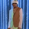 Igor character Tyler the Creator wearing brown and mint color outfit from his Igor album look.