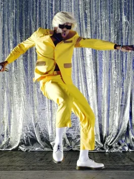 Igor suit Tyler the Creator yellow bellhop outfit from his live Igor performance showcasing his bold fashion style.