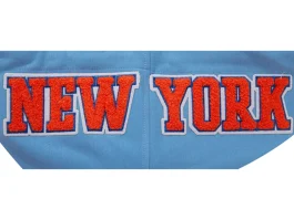 Knicks logo patch design on blue team hoodie