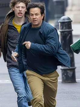 Mark Wahlberg in The Family Plan 2 blue jacket, looking stylish while walking in the street