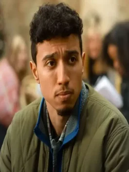 Reda Elazouar in The Family Plan 2 Quilted Jacket walking on a lively street