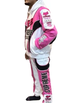 Side view of a pink and white Supreme Fox Racing hoodie and pants set featuring premium embroidery and a racing-inspired aesthetic.
