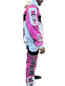 Full profile of the Supreme Fox Racing hoodie and pants set showcasing the coordinated pink, white, and black colorway and branding.