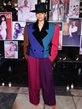Zendaya wearing a Marc Jacobs color block zoot suit in bold colors at a Vanity Fair celebration.