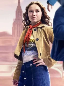 Zoe Colletti looking concerned in a corduroy jacket while carrying a child in The Family Plan 2