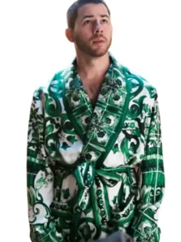 Front view of Nick Jonas wearing the green robe featured in A Very Jonas Christmas 2025. The luxurious patterned Nick Jonas Green Robe is tied at the waist. Buy Nick Jonas Green Robe.