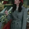 Kaya Scodelario Plaid Trench Coat trench coat and red beret, completing her stylish plaid coat look in a marketplace scene.