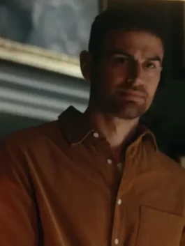 The Gentlemen Netflix Theo James brown shirt showing the handsome Eddie Horniman in his brown dress shirt The Gentlemen wardrobe.