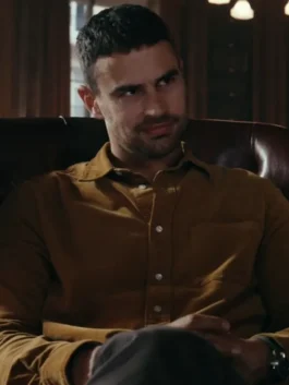 Theo James Brown Shirt Horniman in his brown button up shirt from The Gentlemen, showcasing a serious, thoughtful expression.
