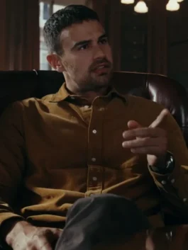 Close-up of Theo James brown shirt The Gentlemen look, highlighting the soft texture of the brown collared shirt worn by Eddie Horniman.