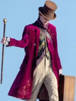 The famous Timothée Chalamet 2023 Wonka Maroon velvet coat is seen here, complete with the character's top hat and cane.