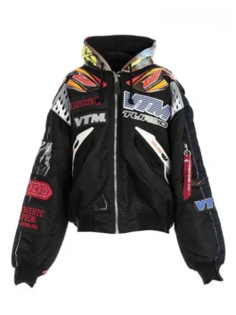 Vetements x Alpha Industries Hooded Racing Jacket in black with multicolored patches and a graphic hooded collar.
