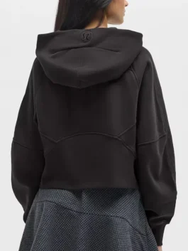 Back view of the black NFL x lululemon women's oversized scuba half zip hoodie for the New York Jets.