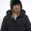 Alexandra Breckenridge black puffer coat My Secret Santa. Close-up of Alexandra Breckenridge Christmas movie black puffer coat.