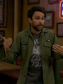 Charlie Day green jacket outfit from It's Always Sunny in Philadelphia. Close-up of charlie jacket on sunny in philadelphia with embroidered patches on the pockets.