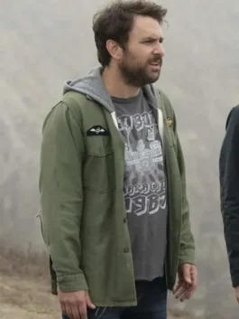 Charlie Kelly green jacket from Always Sunny in Philadelphia. He wears the iconic utility charlie kelly jacket while holding up a sheet of stickers in an episode.