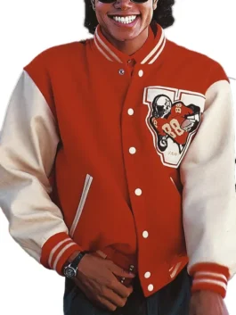 Frontal view of Jaafar Jackson wearing the red varsity jacket with a graphic patch. Jaafar Michael Jackson varsity jacket.