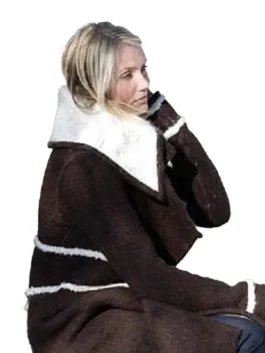 Full-body shot of Cameron Diaz in the distinctive brown wool coat with white trim she wore in The Holiday movie.