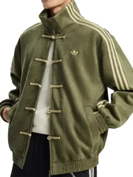 Angled view of the Adidas Chinese New Year 2026 Green Jacket open to show the white shirt underneath. Details include the Adidas 2026 Chinese New Year Green Jacket with frog closures.